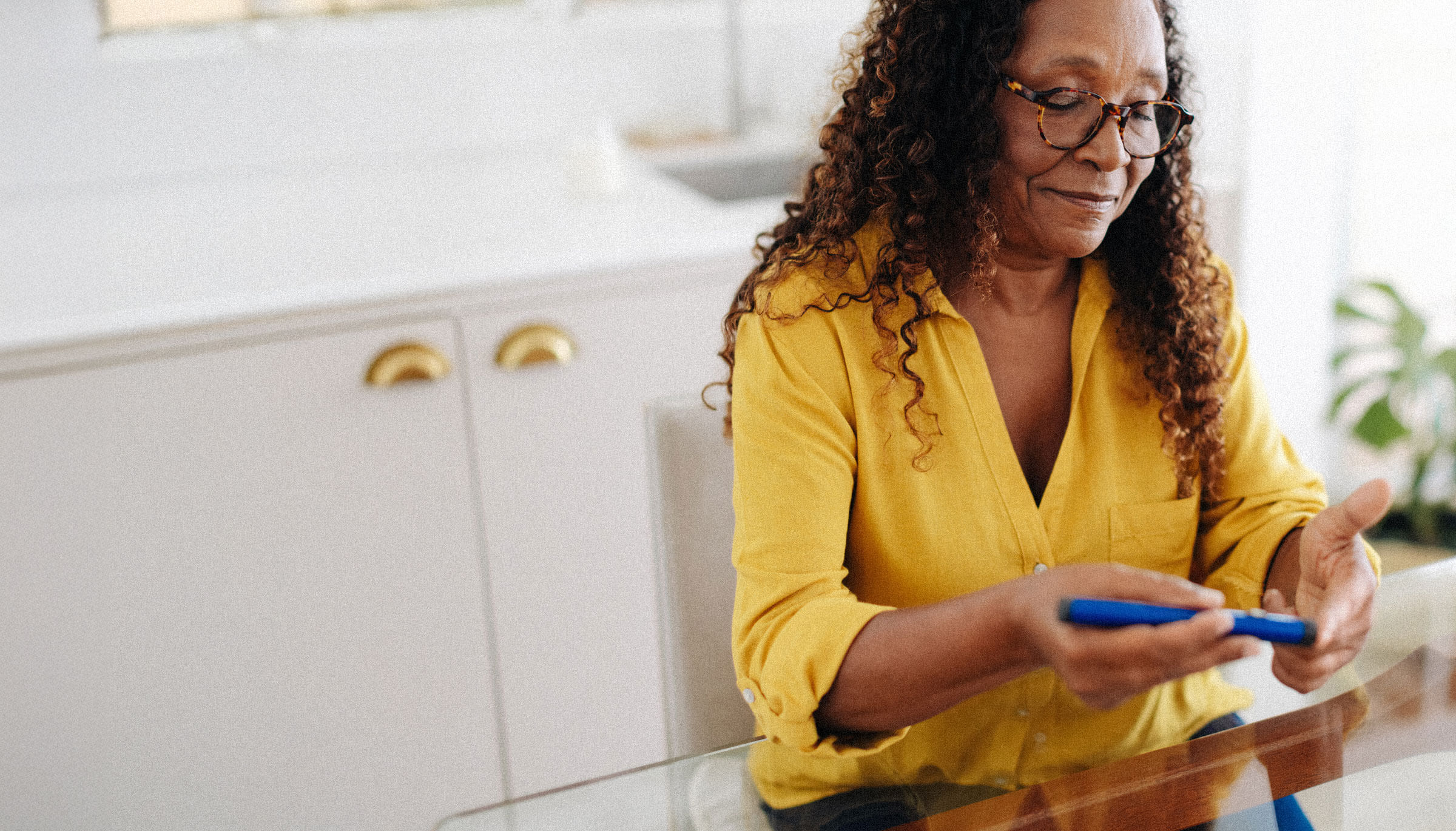 Diabetic woman calmly checking her blood glucose levels